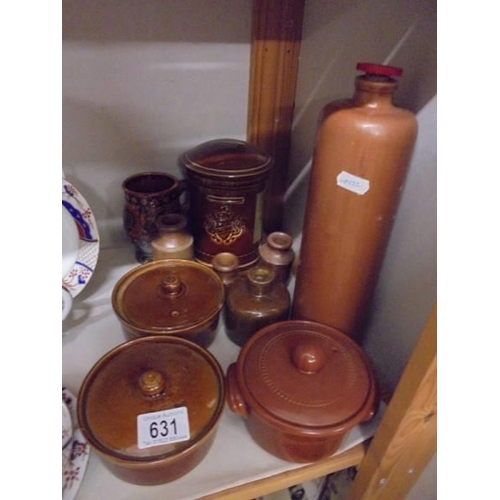 631 - A mixed lot of stoneware bottles, lidded dishes etc.,