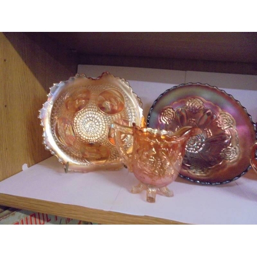 637 - Four carnival glass dishes and three jugs.