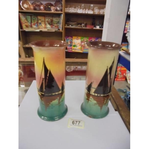 677 - A pair of Doulton style hand painted vases, one a/f.