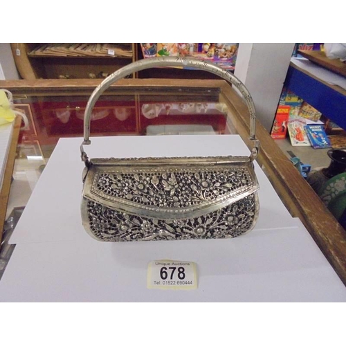 678 - A decorative white metal evening bag.