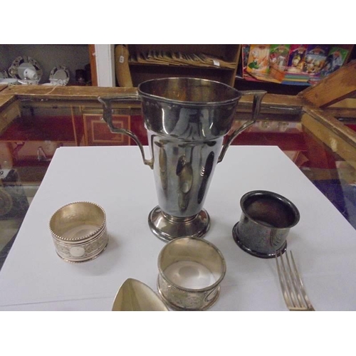 688 - A mixed lot including napkin rings, cutlery etc.,