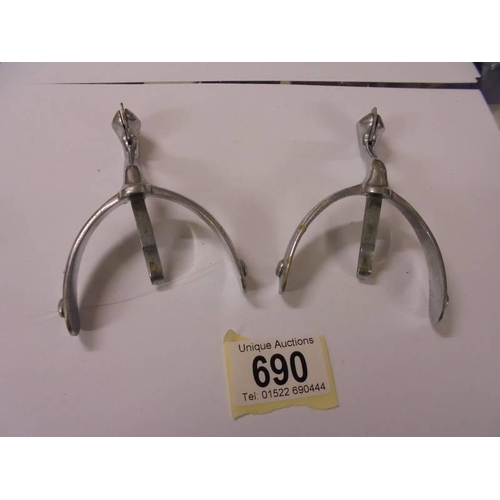 690 - A pair of vintage chrome plated riding spurs.