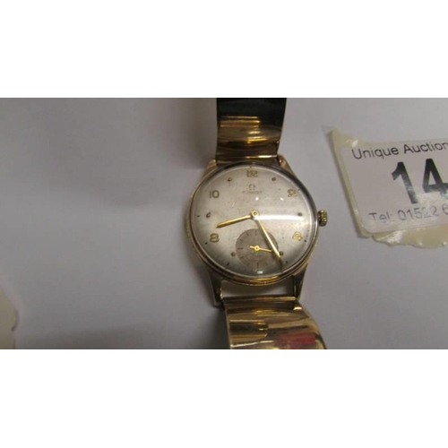 14 - A 9ct gold Omega wrist watch on a 9ct gold bracelet, in working order. 36 grams total weight.