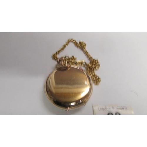 23 - A Waltham pocket watch and chain, gold filled case, 50mm diameter, white dial, in working order. Ser... 