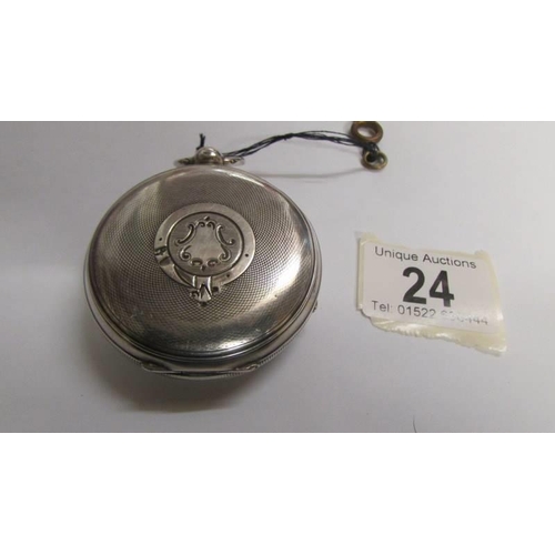 24 - A Chester silver English lever pocket watch with key, circa 1900, 58mm diameter in working order.