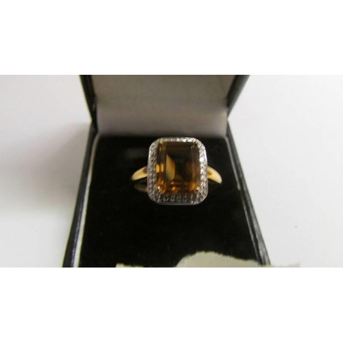 8 - A 9ct gold ring set amber coloured stone, size S half, 3.1 grams.