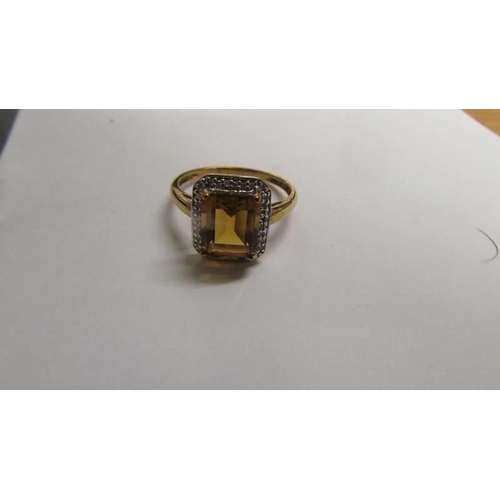 8 - A 9ct gold ring set amber coloured stone, size S half, 3.1 grams.