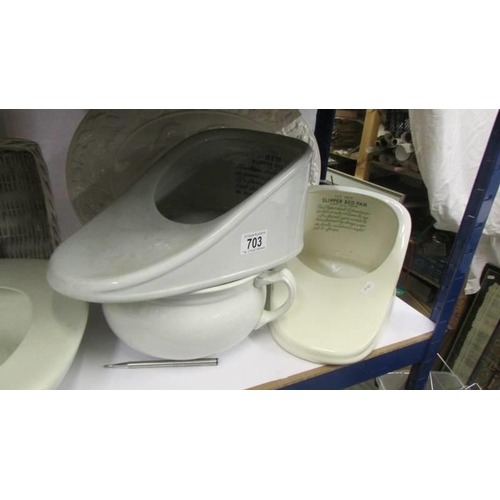 703 - Three ceramic bed pans, a chamber pot, meat platter etc.,