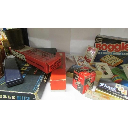 707 - A good lot of vintage games, playing cards etc.,