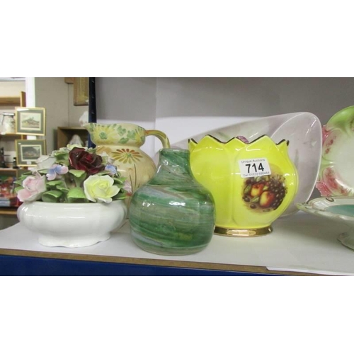 714 - A mixed lot of ceramic vases, plates, planter etc.,