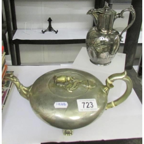 723 - A decorative silver plate tea pot and a hot water jug.