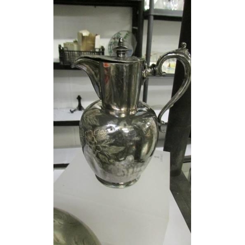 723 - A decorative silver plate tea pot and a hot water jug.