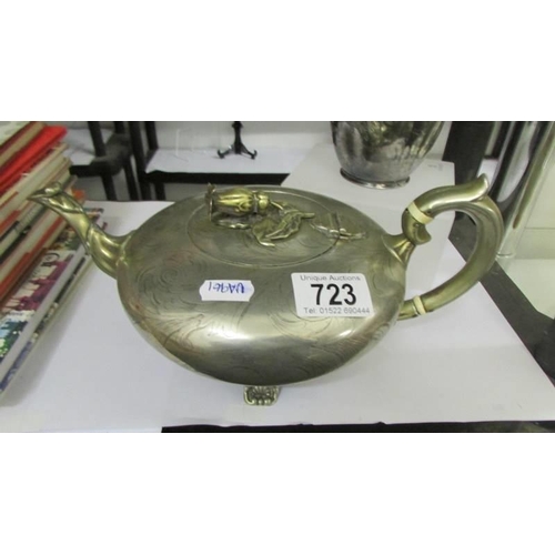 723 - A decorative silver plate tea pot and a hot water jug.