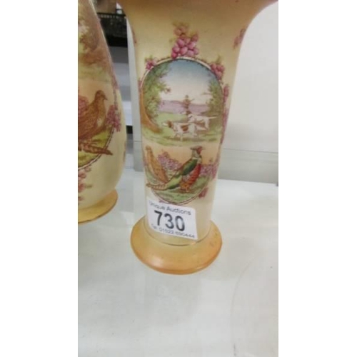 730 - Two vases decorated with pheasants, (1 a/f, hairline crack to neck).