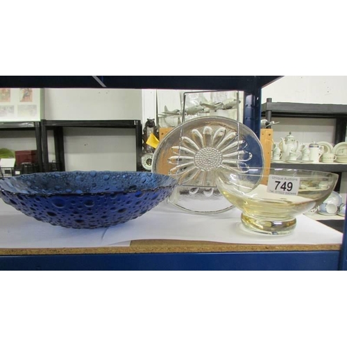 749 - A glass cake plate and two glass bowls.