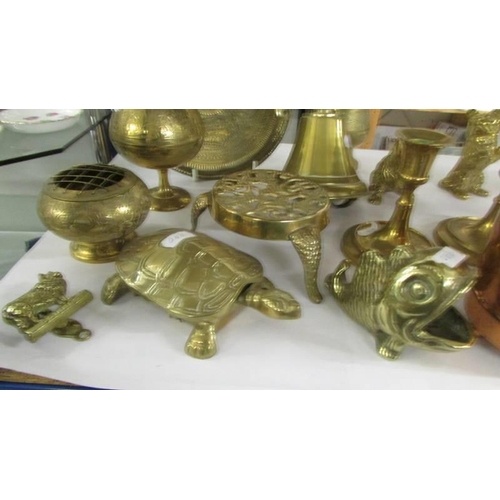 750 - A mixed lot of brass ware including bell, candlesticks etc.,