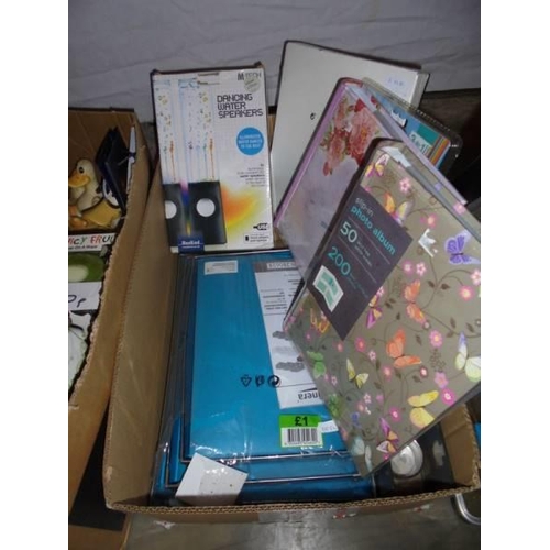 880 - Two boxes of new items including picture frames, dangling water speakers, both bass etc.,