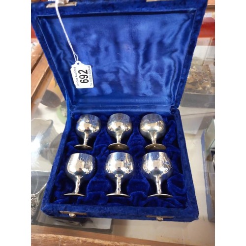 692 - A cased set of six silver plate goblets.