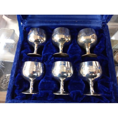 692 - A cased set of six silver plate goblets.