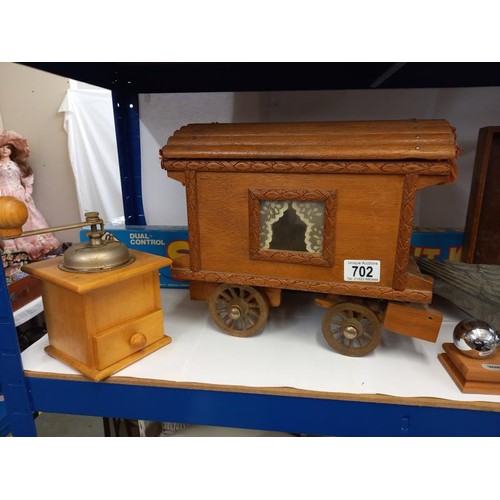 702 - A shelf of miscellaneous including gypsy caravan, coffee grinder, kitchen measure etc.,