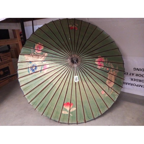 743 - A hand painted parasol.