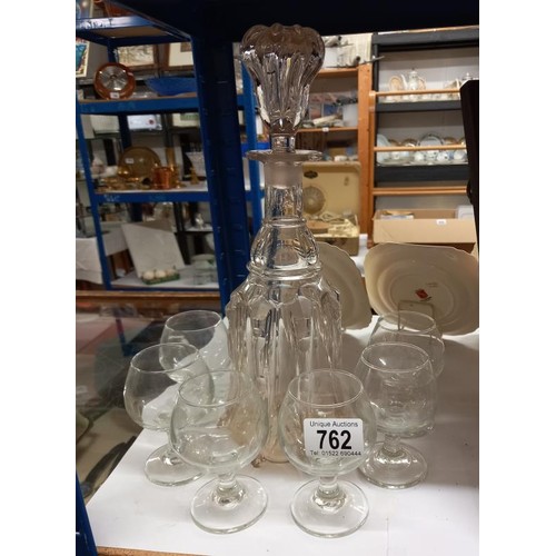 762 - A decanter and six brandy goblets.