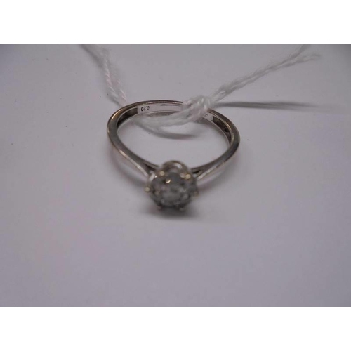 29 - A white gold floral diamond ring, size N half, 1.9 grams.