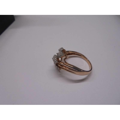 31 - A yellow gold and diamond shaped ring, size O half, 2.9 grams.