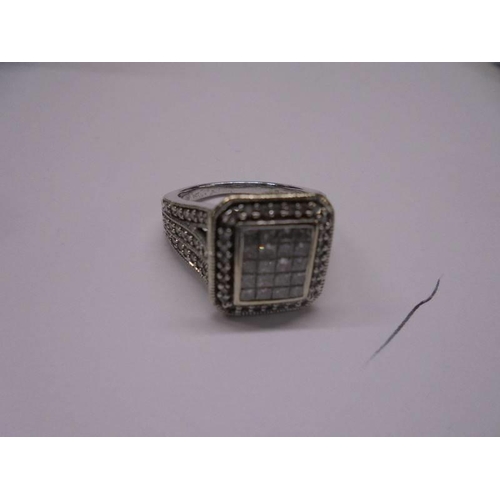 37 - A 1 ct plus square shaped diamond ring, 6.9 grams. size L.