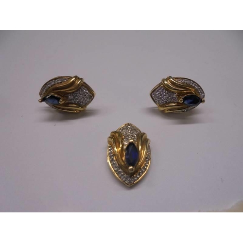 40 - An 18ct gold sapphire and diamond pendant and earring set. 7.3 grams.