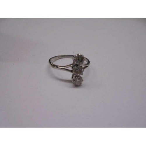 41 - A three stone 18ct gold diamond ring, size J half, 1.9 grams.