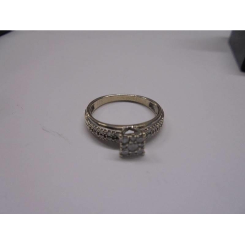 42 - A white gold square shaped diamond ring, size N, 2.7 grams