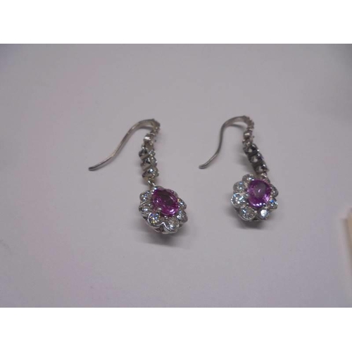 43 - A pair of 18ct white gold pink sapphire and diamond earrings.