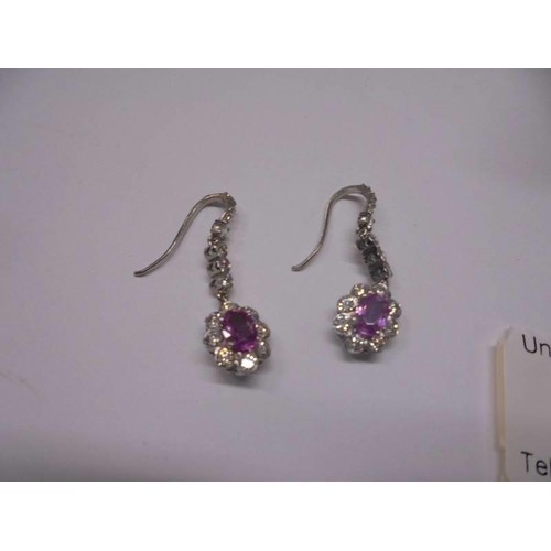 43 - A pair of 18ct white gold pink sapphire and diamond earrings.