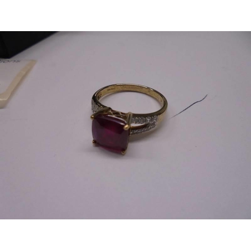 45 - A yellow gold diamond and ruby ring, size N, 2.9 grams.