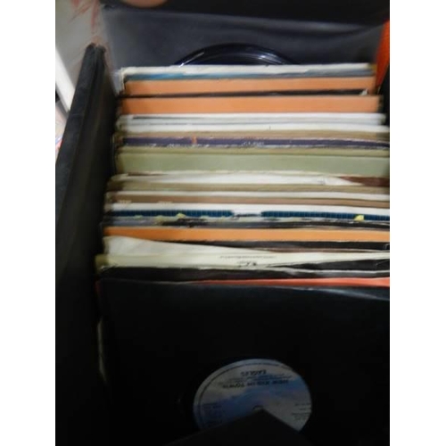 527 - A quantity of 45 rpm records and DVD's.