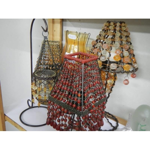 533 - A shelf of table/candle lamps etc.,