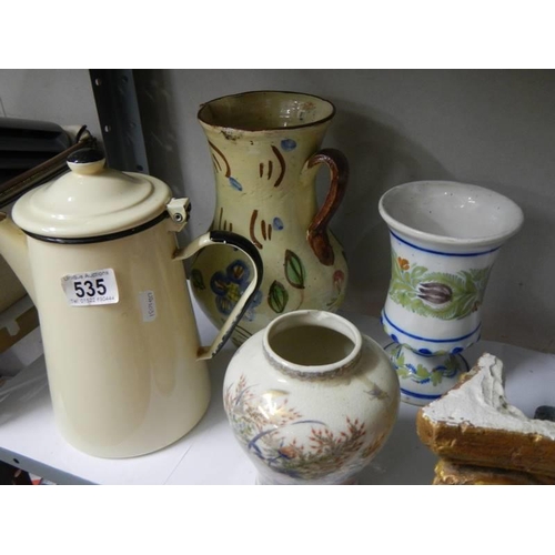 535 - A tray of interesting items including jugs etc.,