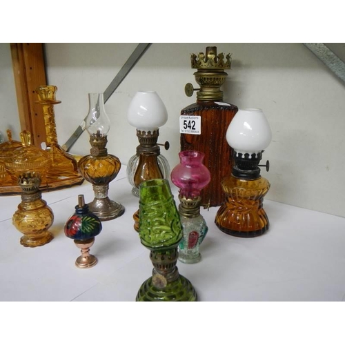 542 - A selection of small oil lamps.