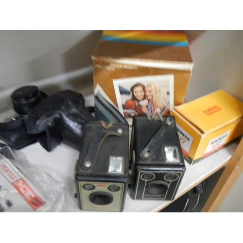 551 - A quantity of camera's and accessories.