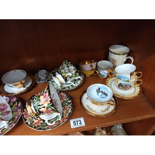 573 - A selection of china cups & saucers including Royal Albert