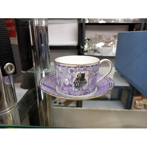 615 - A boxed pair of Wedgwood Millenium tea cups and saucers.