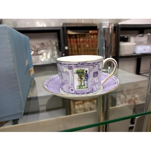 615 - A boxed pair of Wedgwood Millenium tea cups and saucers.