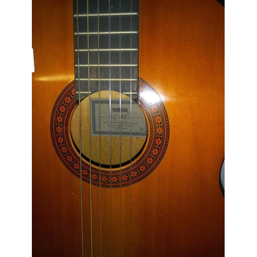 619 - A Yamaha C-40 acoustic guitar (stand not included)