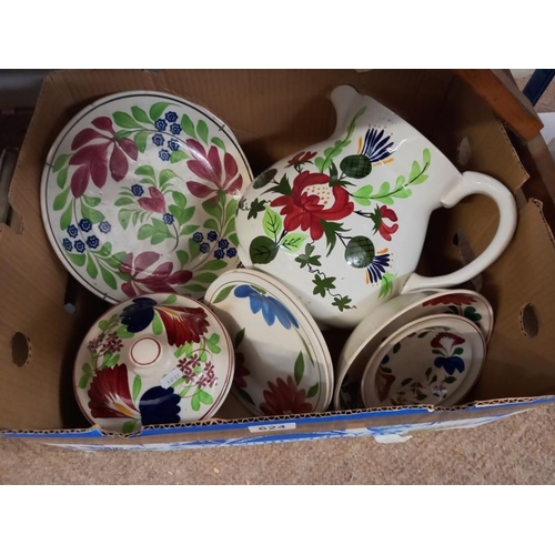 624 - A floral pottery jug & other items including plates