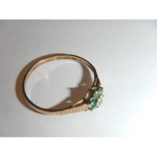 1 - A 9ct gold cluster ring set diamond chip and green stones, size L, 0.9 grams.