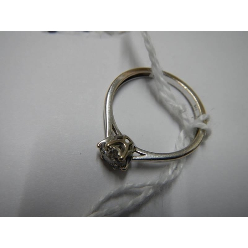 29 - A white gold floral diamond ring, size N half, 1.9 grams.