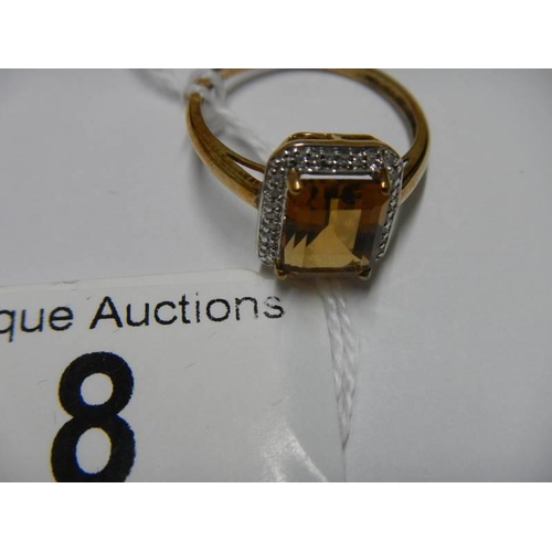 8 - A 9ct gold ring set amber coloured stone, size S half, 3.1 grams.