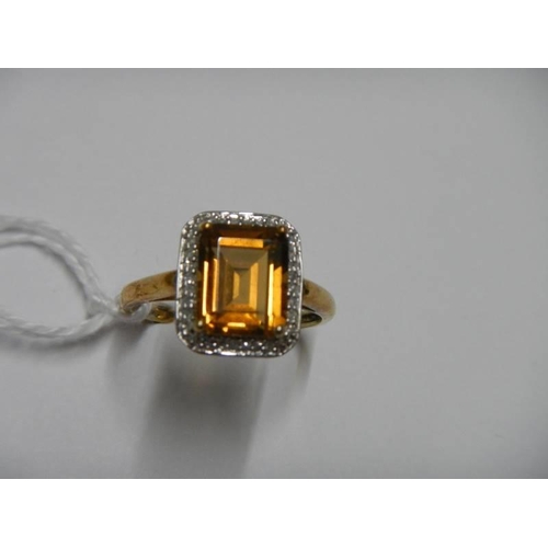 8 - A 9ct gold ring set amber coloured stone, size S half, 3.1 grams.