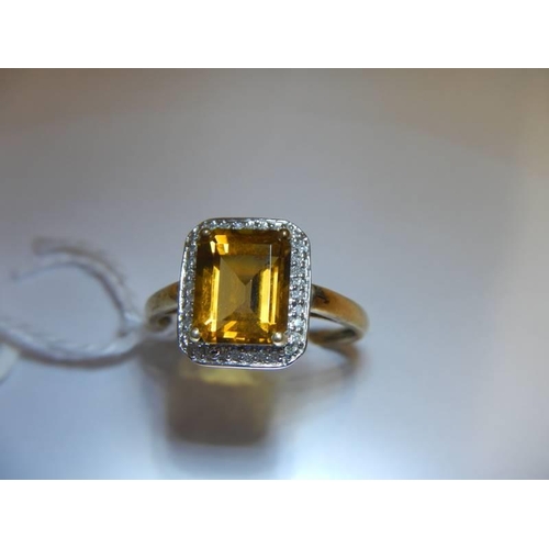 8 - A 9ct gold ring set amber coloured stone, size S half, 3.1 grams.